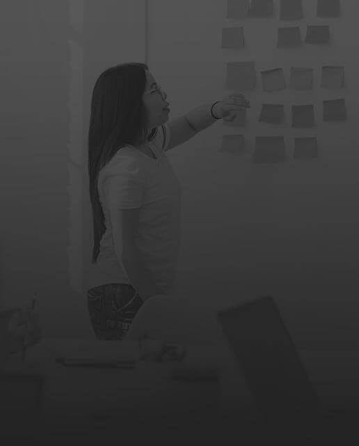 woman in front of whiteboard